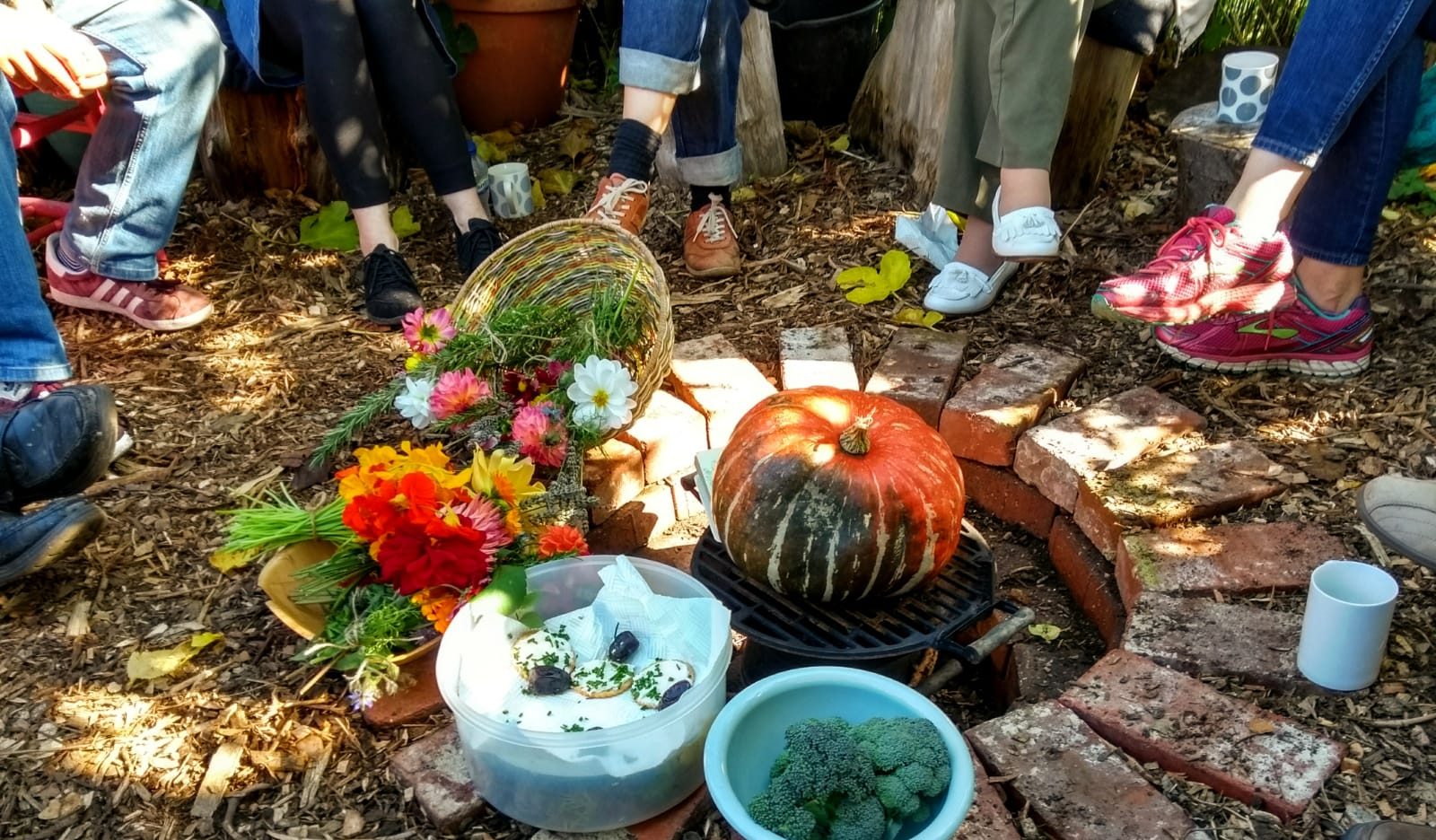 feet around a fire pit filled with harvest